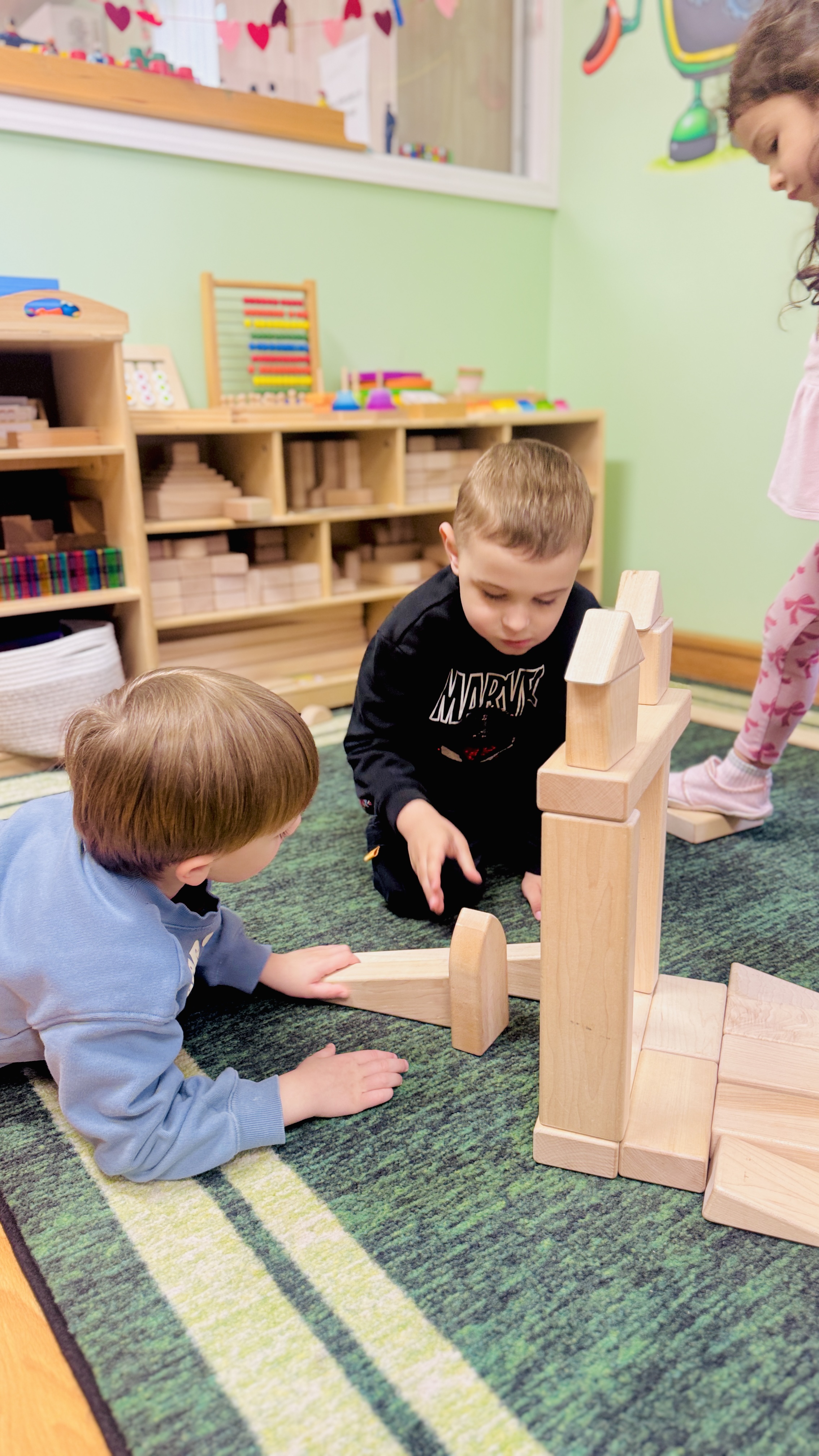 Children building with wooden blocks