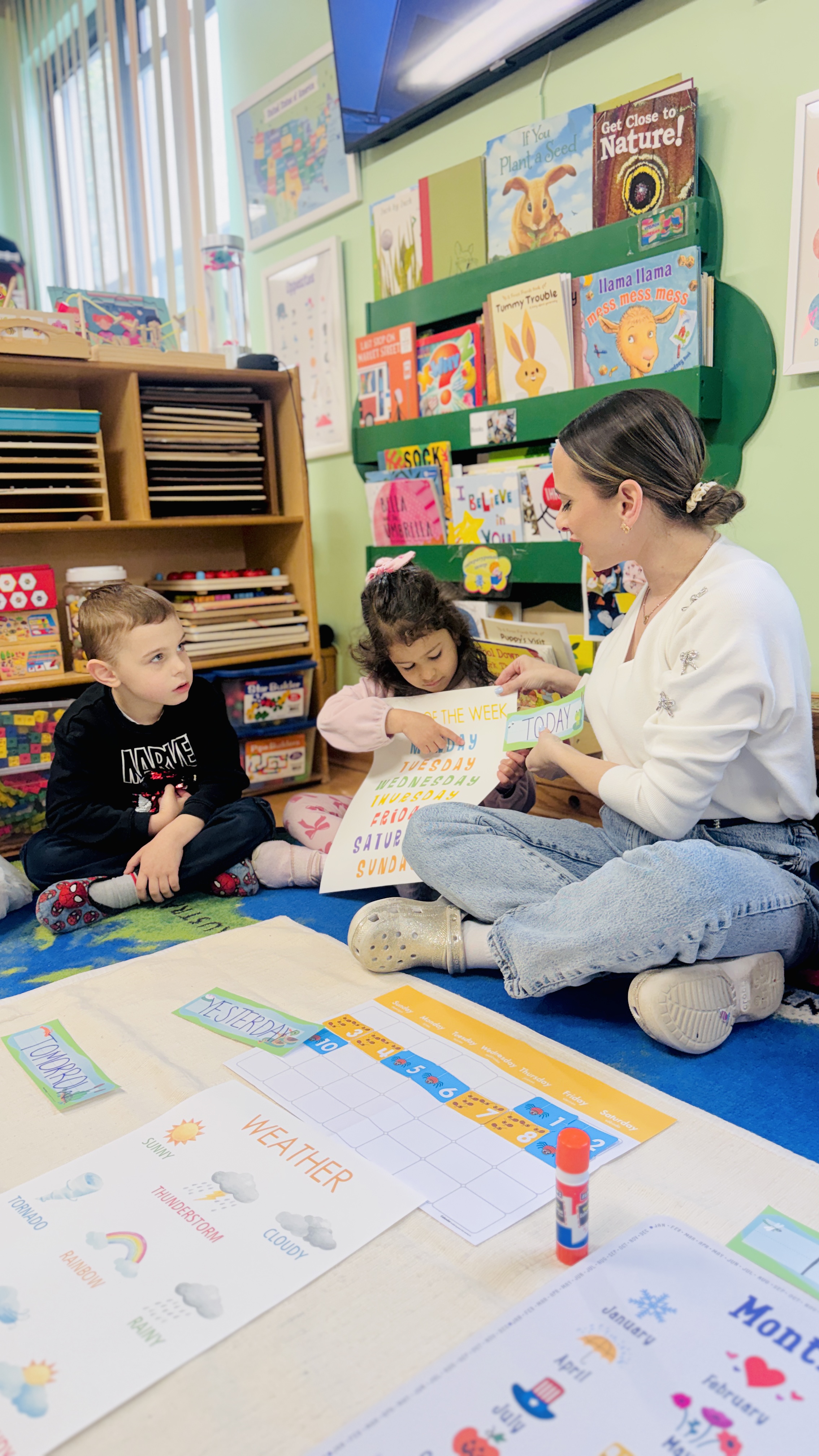 Teacher with children during calendar circle time