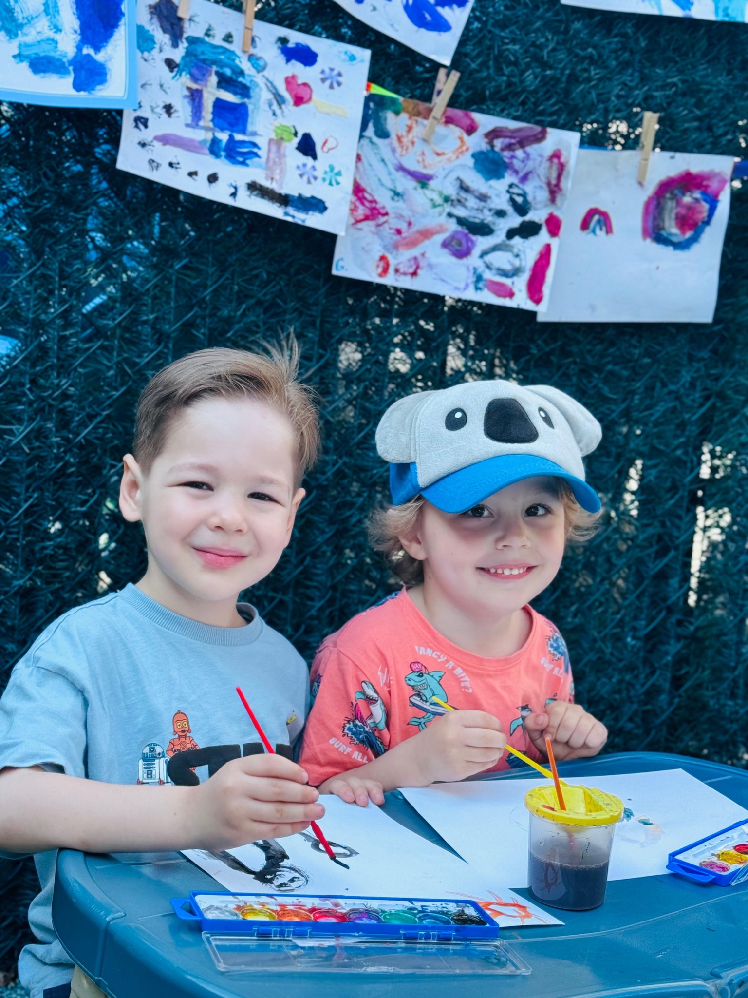 Children painting at outdoor art class