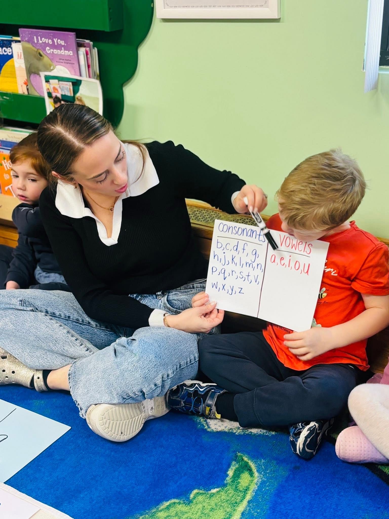 Teacher and children during language lesson
