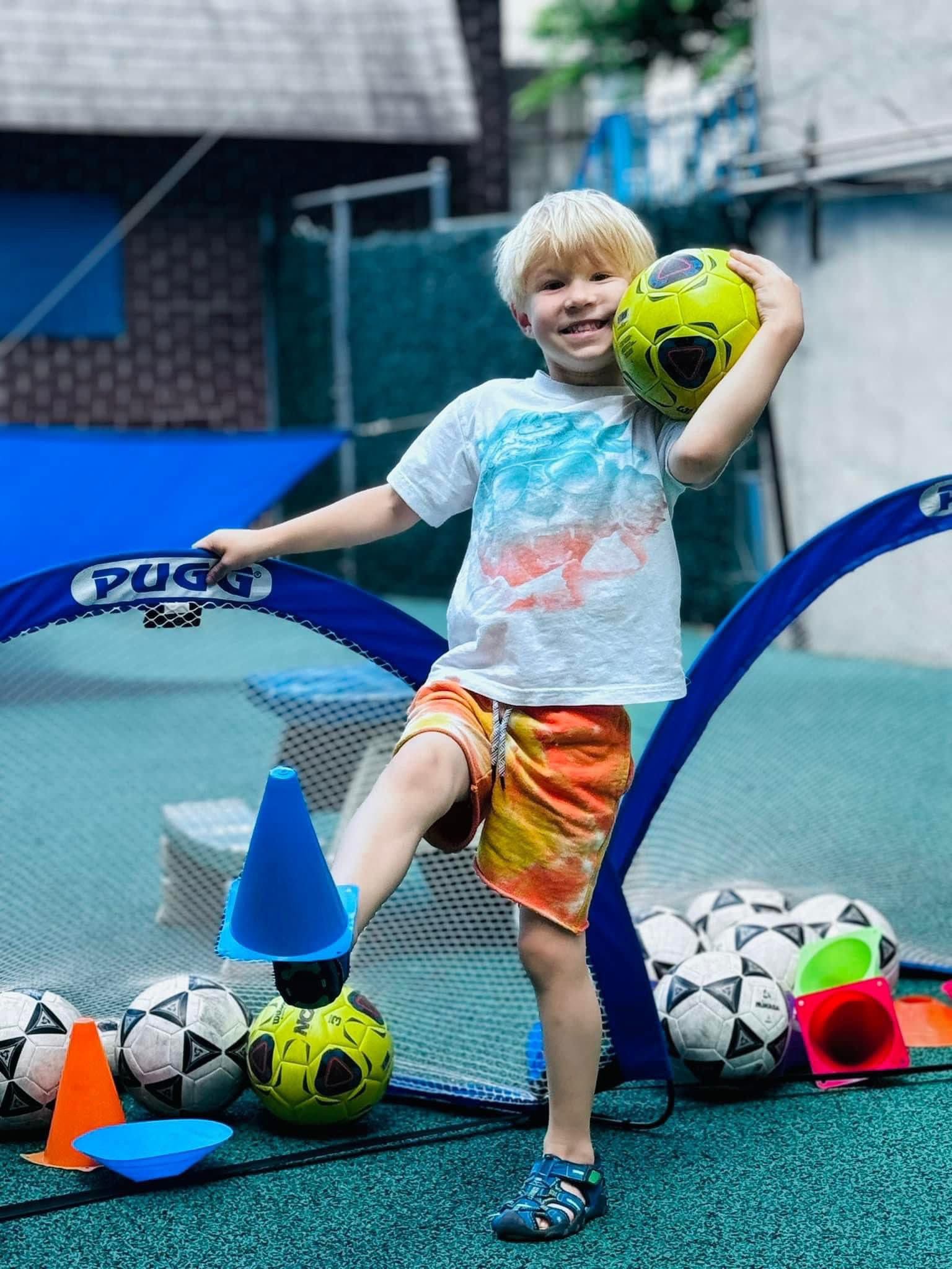 Boy at soccer practice on playground