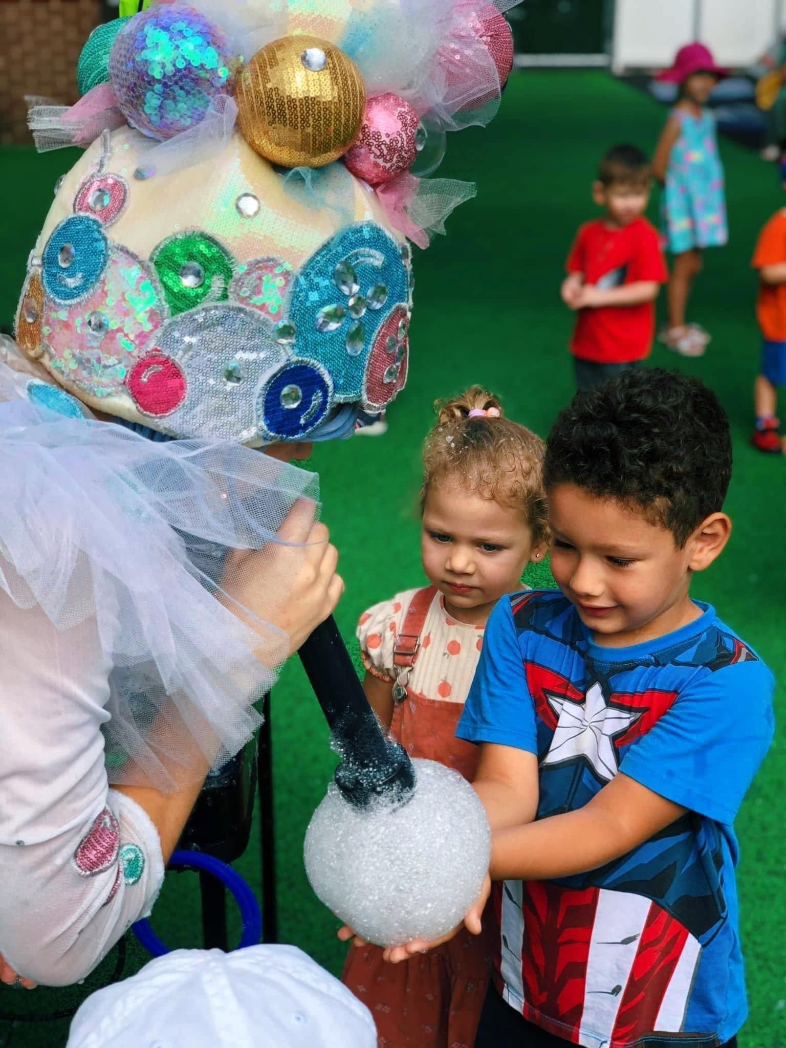 Children at a bubble show performance
