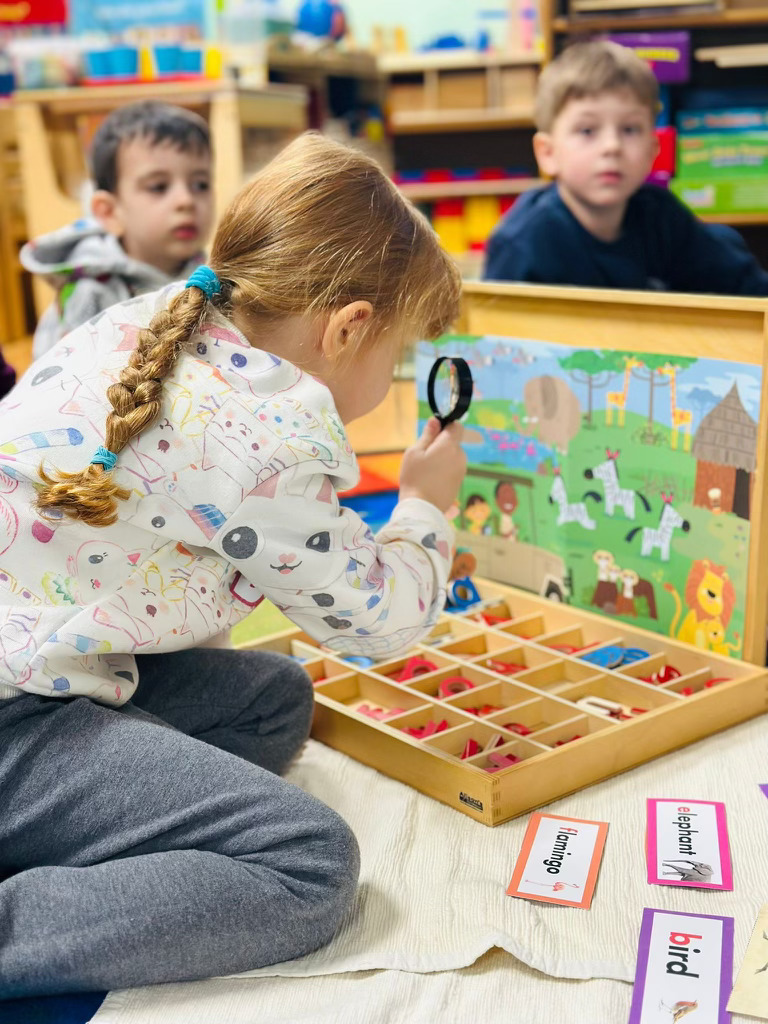 Child exploring with a magnifying glass